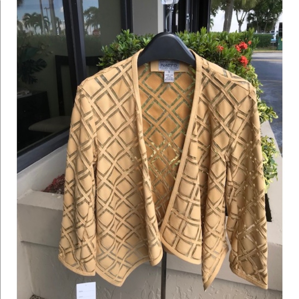 Hand carved leather jacket in golden tan color. A must  for your wardrobe.